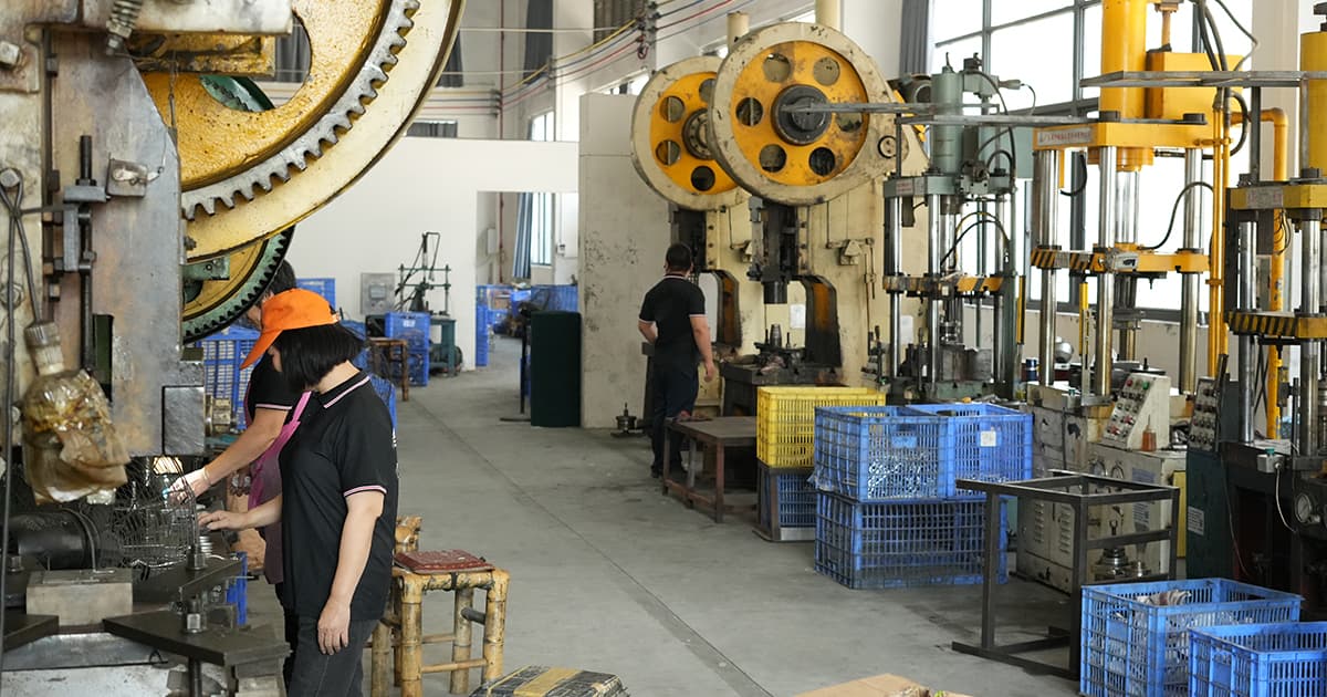 Stainless steel kitchenware manufacturing punch press workshop in Yangjiang, China